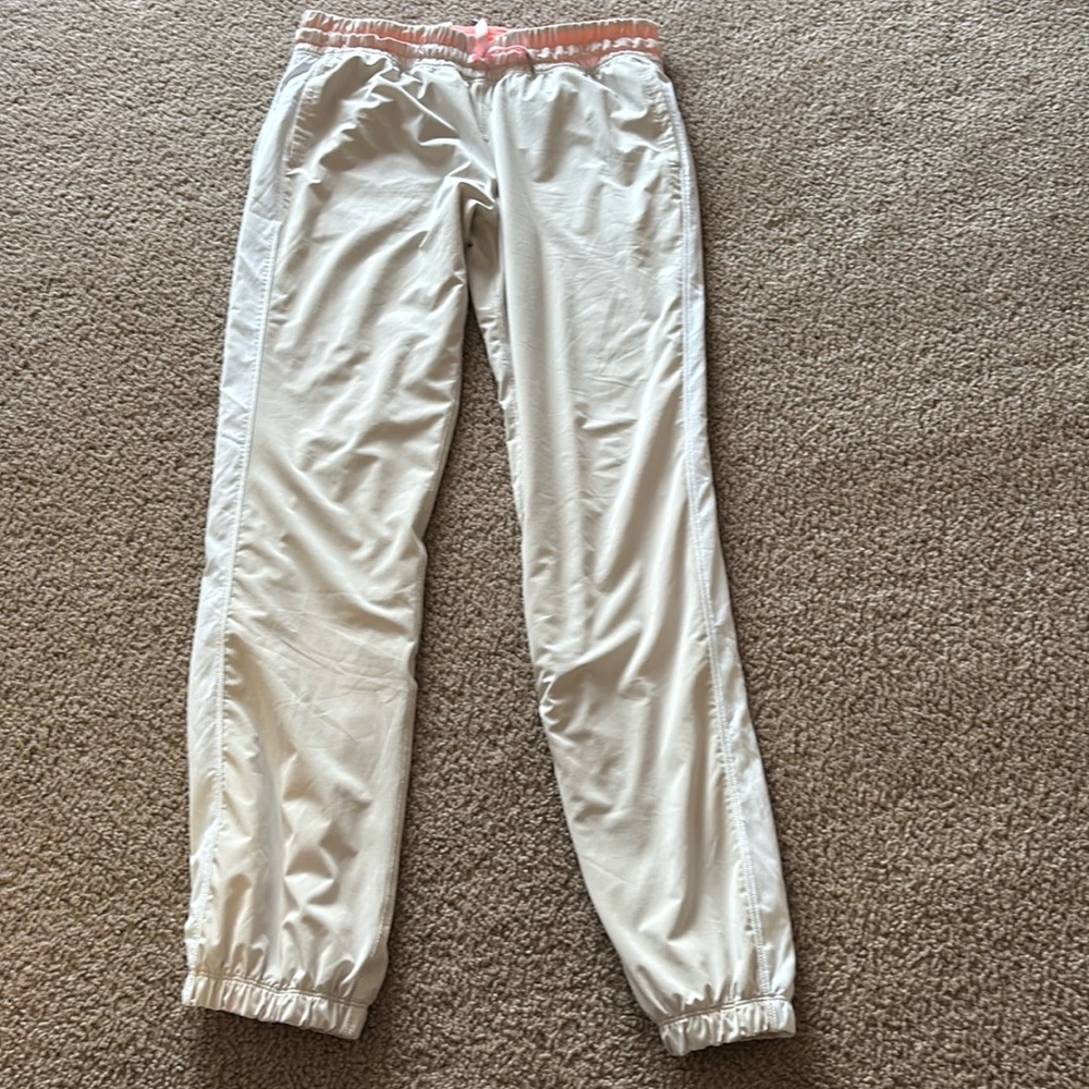 Lululemon athletics size 8 medium cream white strip on side pants